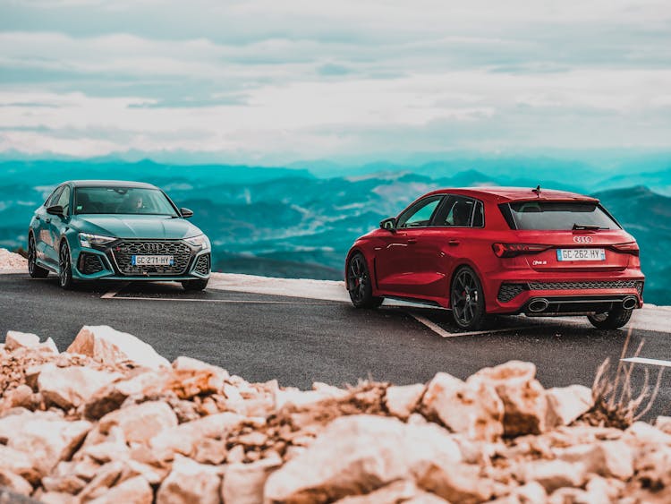 Red Audi RS3 Cars Parked On The Road With Mountain View