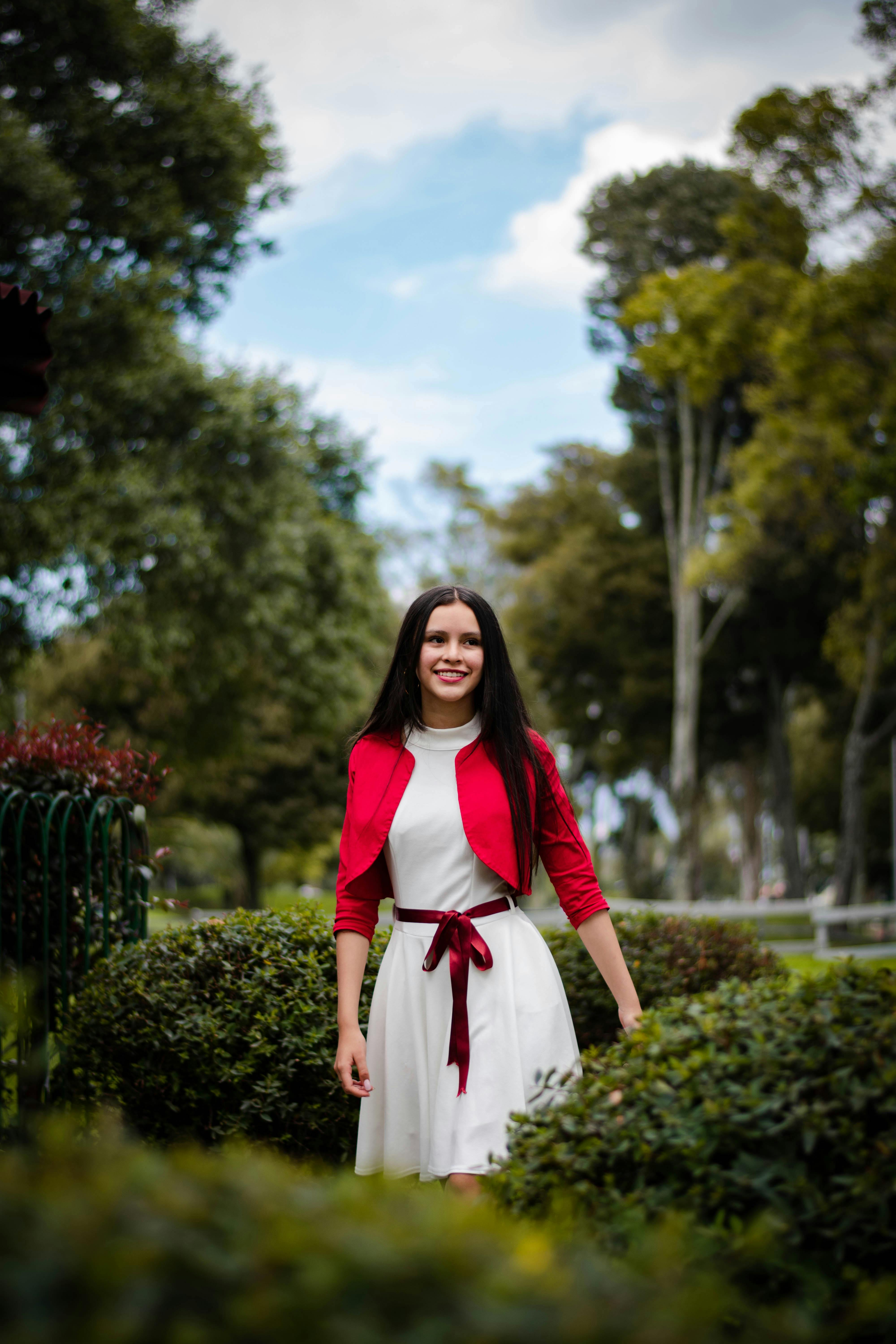 A Woman in White Dress and Red Blazer  Free Stock Photo