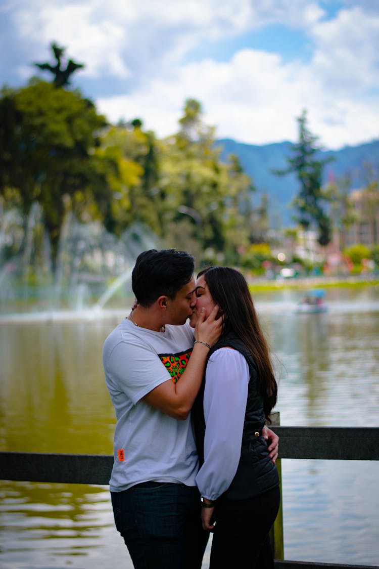 Couple Kissing In Park