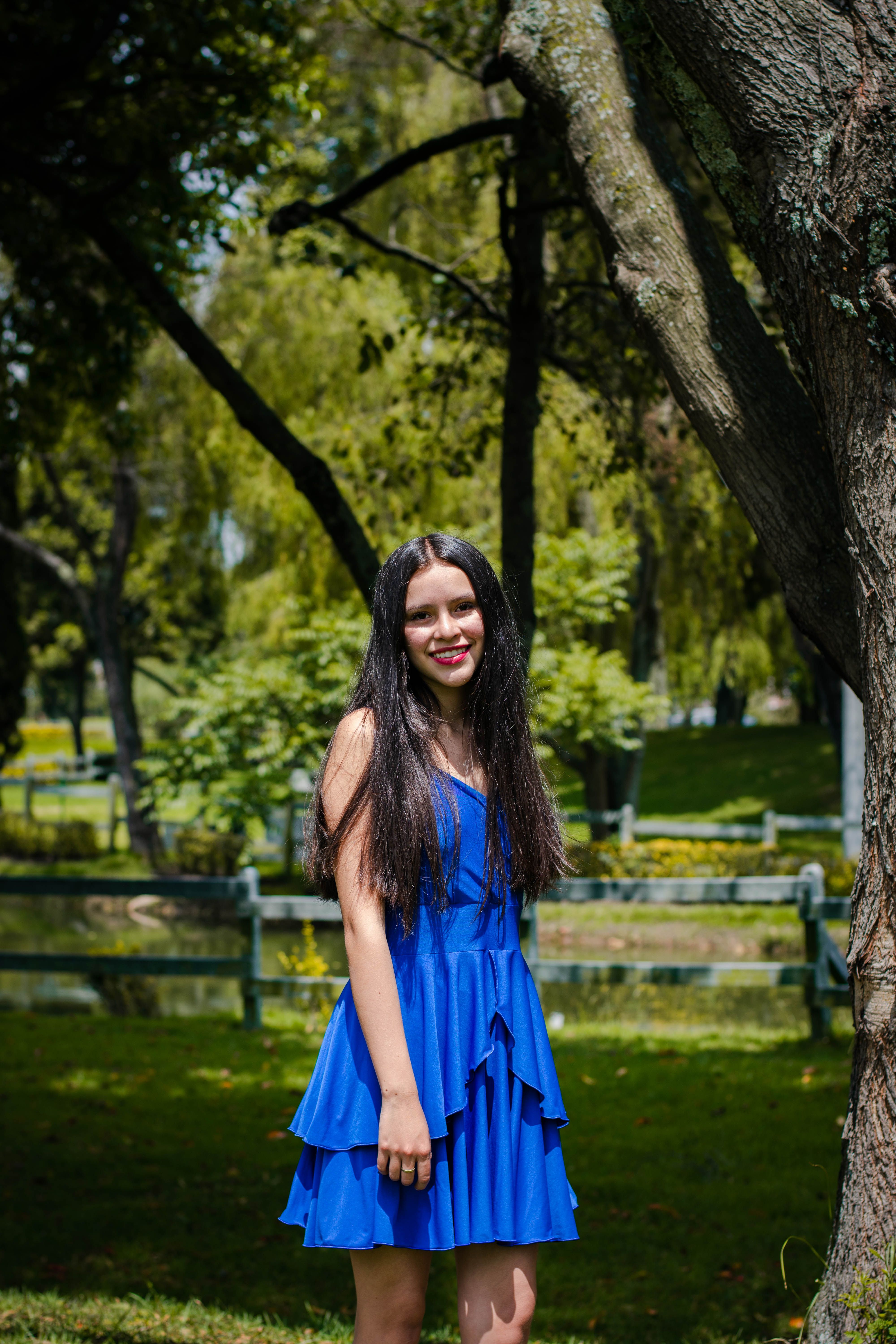 Smiling Woman in Blue Dress · Free Stock Photo