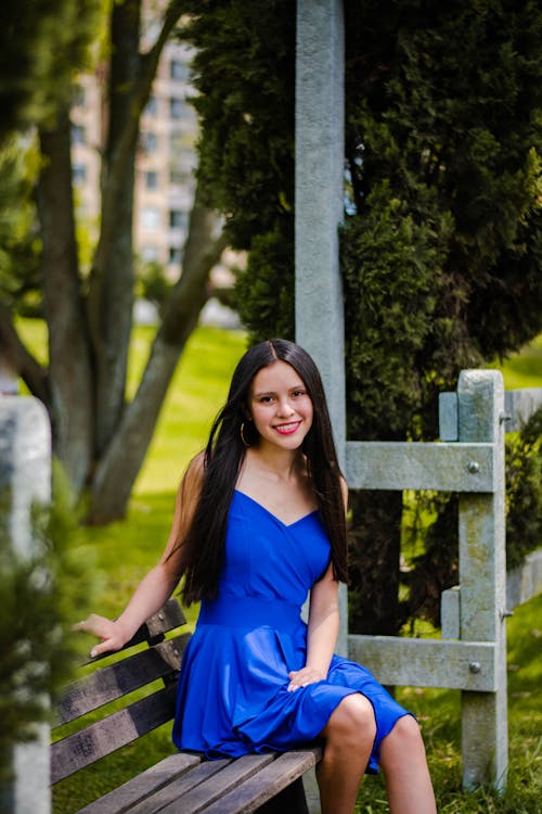 Young Brunette Woman in a Blue Dress