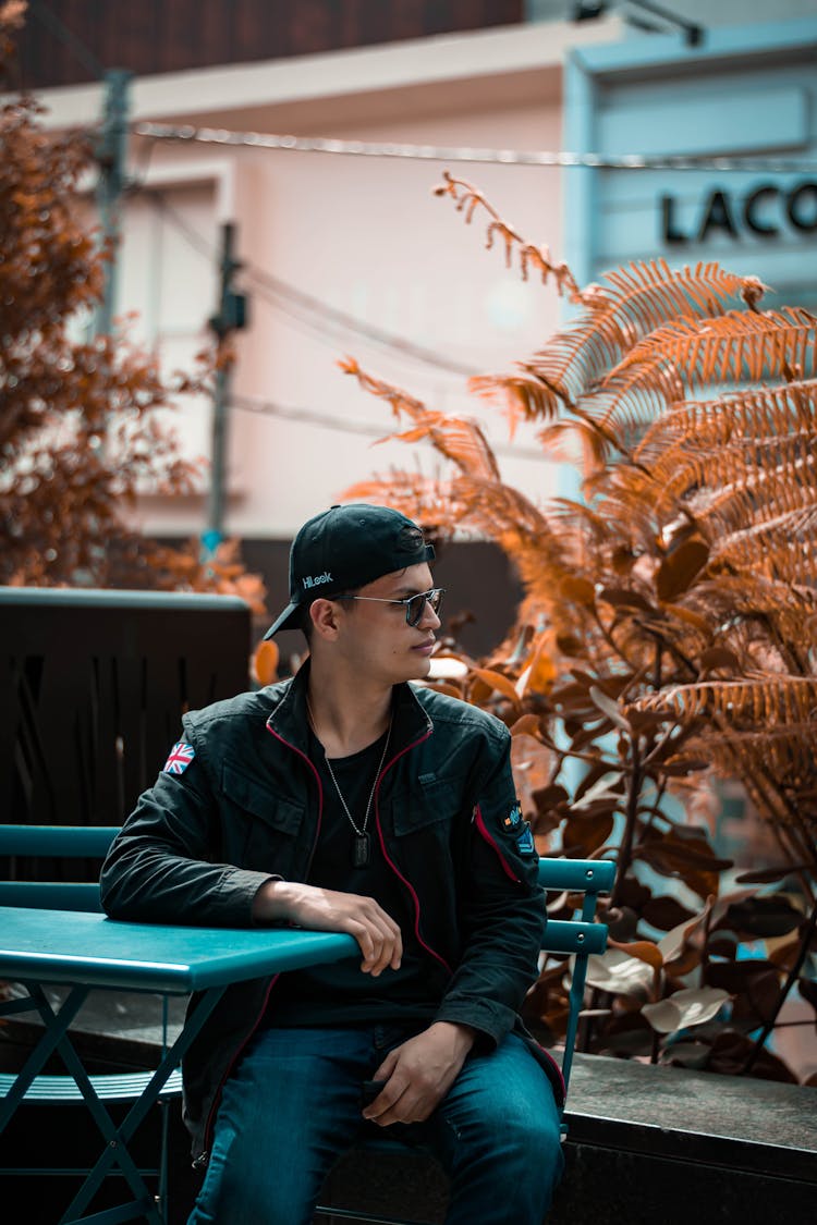 A Man Sitting At The Table While Waiting