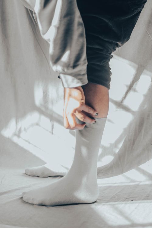 Ribbed white tennis crew socks — photo by Animesh Srivastava on Pexels
