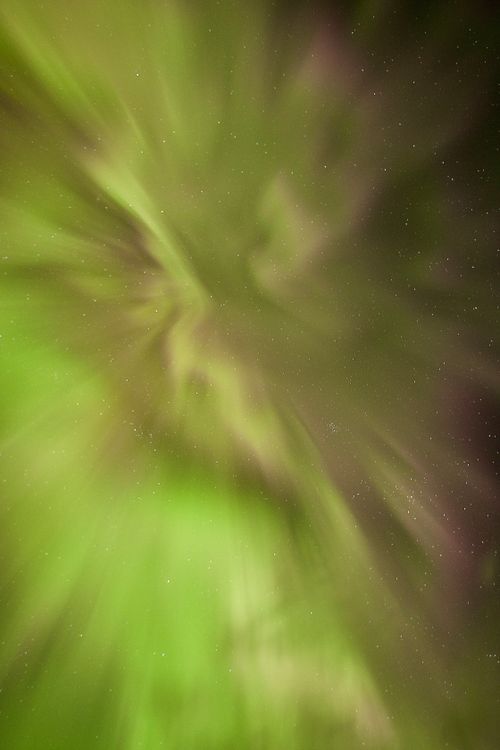 Free Stunning green aurora borealis illuminating the starry night sky in Alberta, Canada. Stock Photo