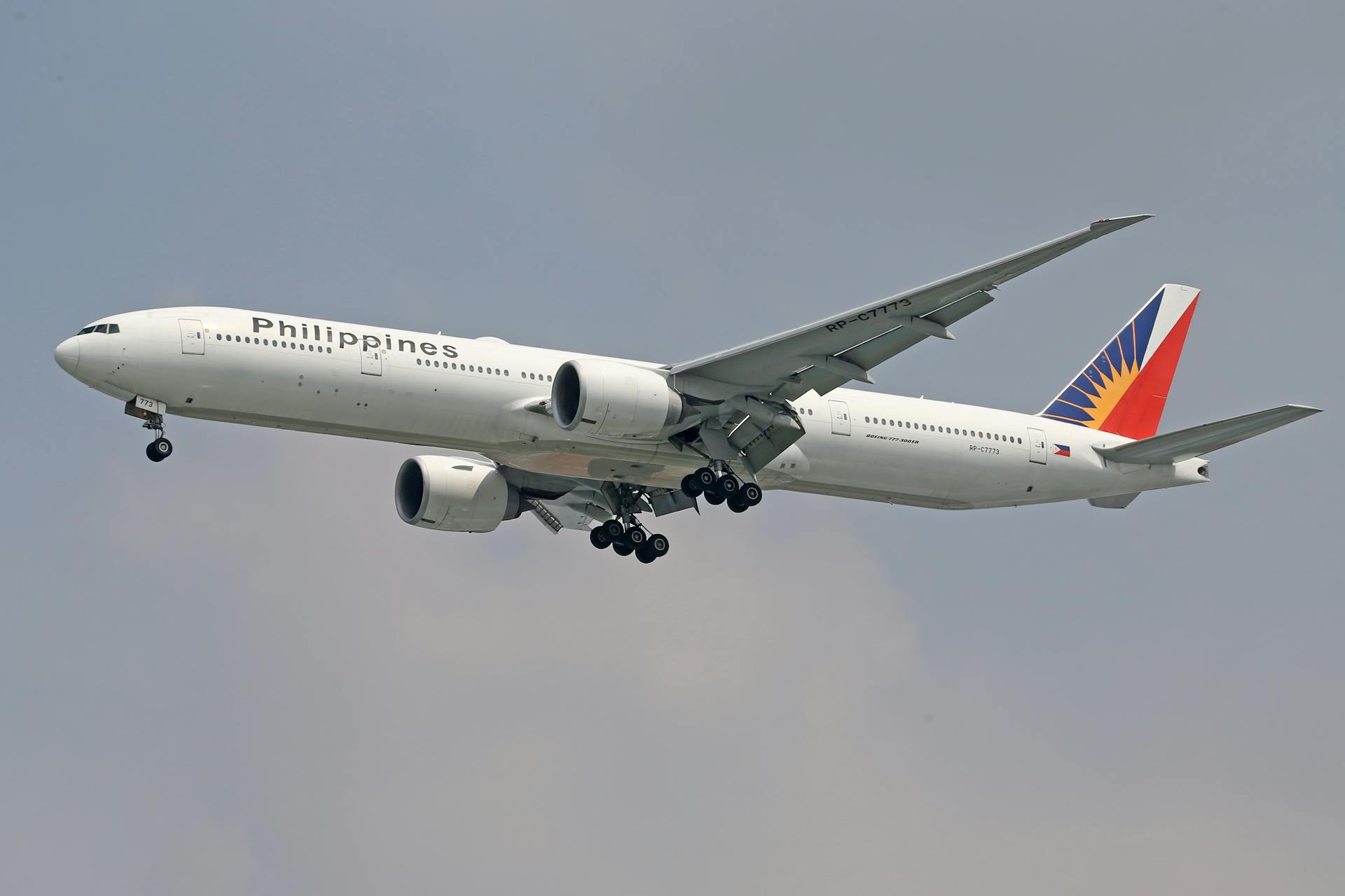 Philippines Airlines jet flying through the sky, showcasing modern aviation technology.