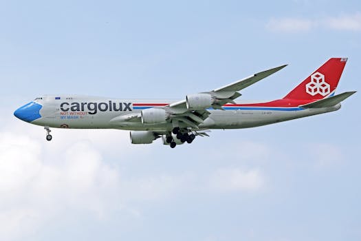 Cargolux plane flying with 'Not Without My Mask' message on a clear day.