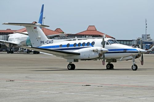 Free A small aircraft parked on an airport tarmac under a clear sky, emphasizing aviation and travel themes. Stock Photo