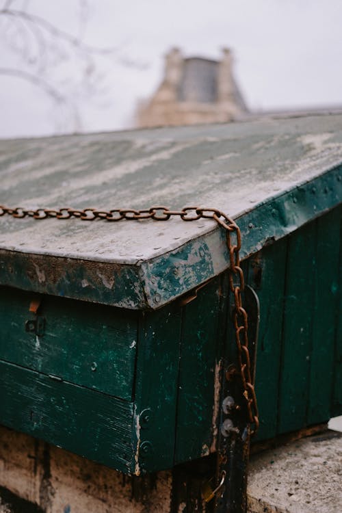 Free Rusty Metal Chain on Green Wooden Box with Padlock Stock Photo