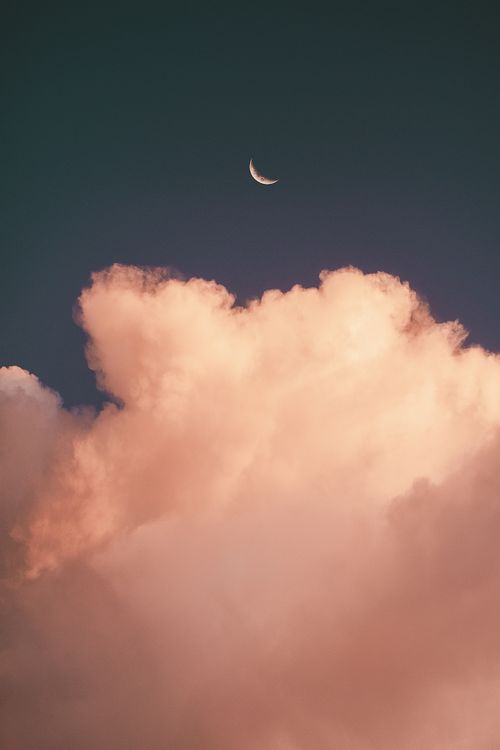 Free Stunning crescent moon captured over vibrant clouds during sunset in Brasília, Brazil. Stock Photo
