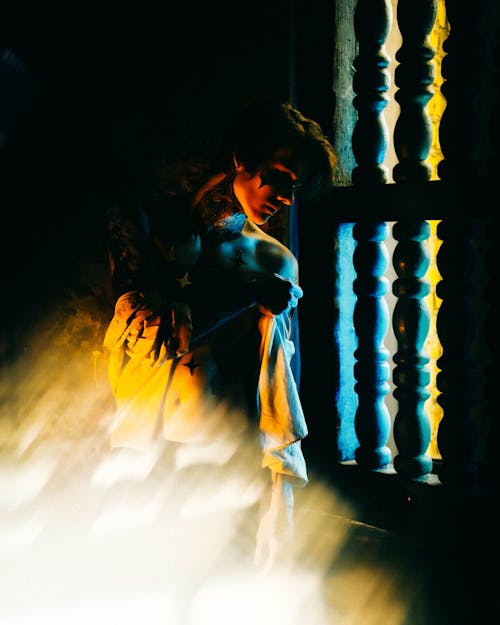 A Man Peeking Through the Wooden Window 