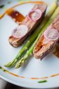 Rare Tenderloin with Green Asparagus Decorated with Spicy Sauce
