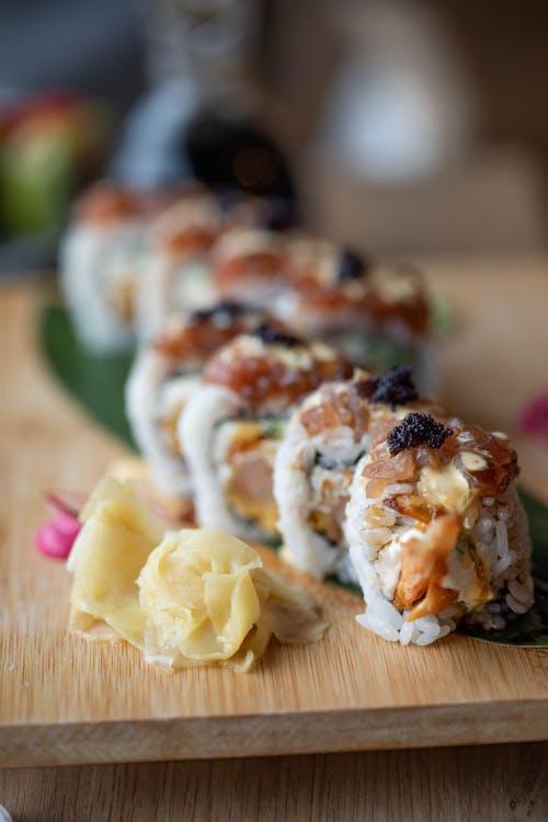 Sushi Roll on Brown Chopping Board