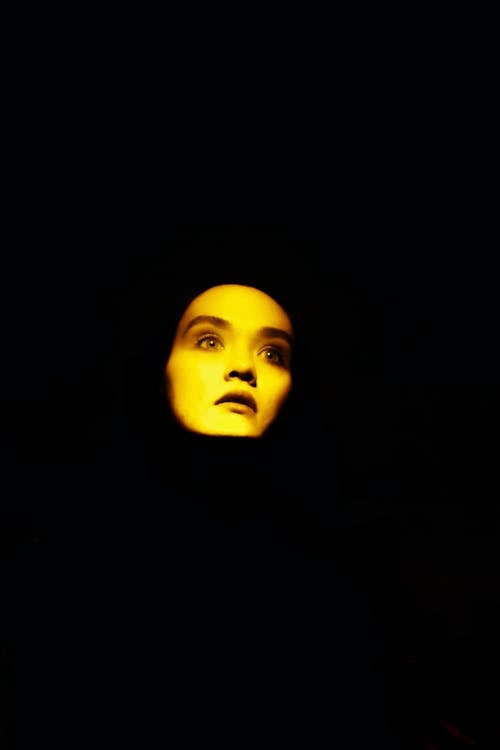 Illuminated Face on Black Background