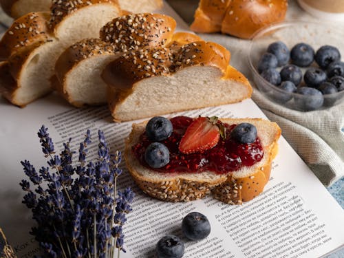 Free Bread with Fruits and Jam on the Book Stock Photo