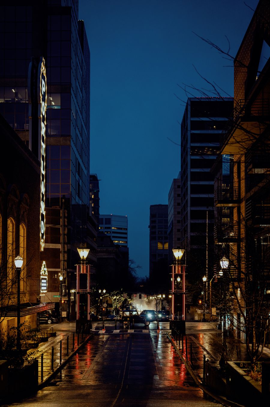 Wet city street at night with reflections