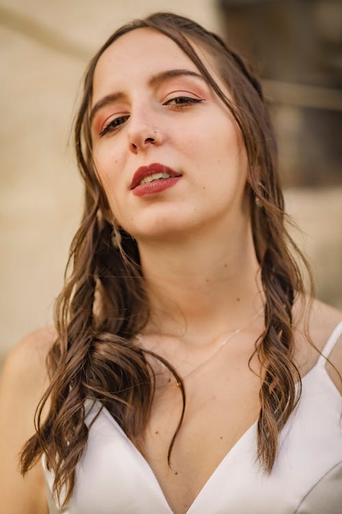 A Woman in White Sleeve Less Dress