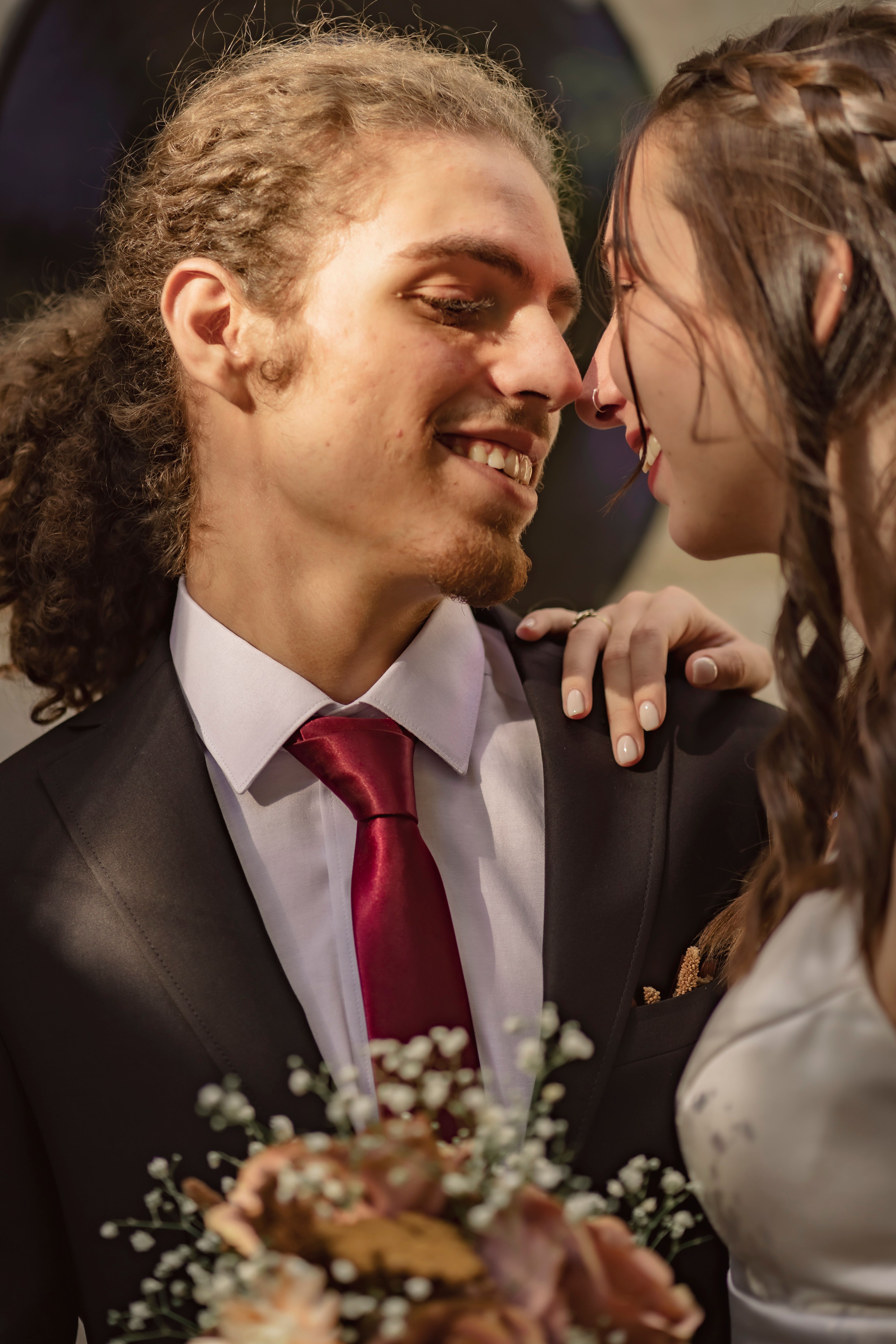 Man in White Suit Kissing Woman in White Wedding Dress · Free Stock Photo