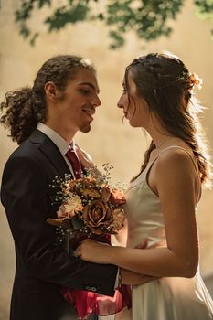 Bride and groom sharing a loving moment during their wedding in Gaziantep under natural light.
