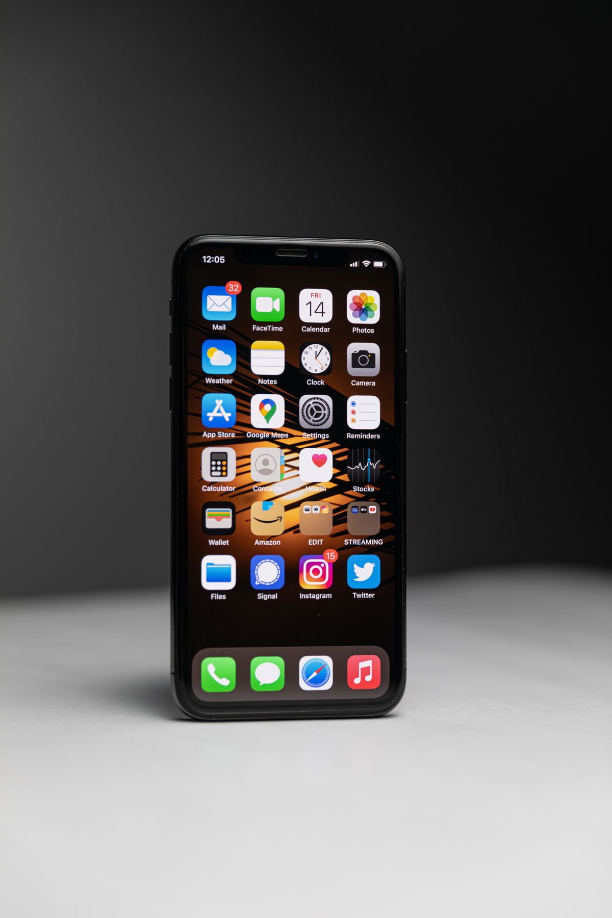 Close up of a smartphone screen showing a grid of app icons