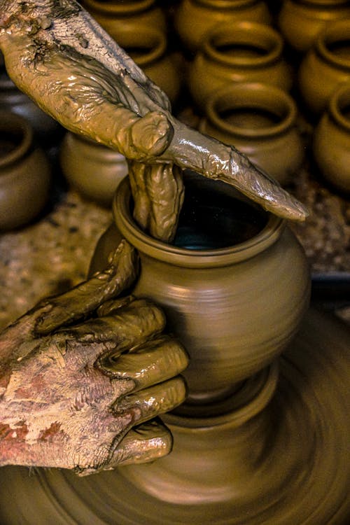 Free Hands of a Person Shaping a Clay Pot Stock Photo