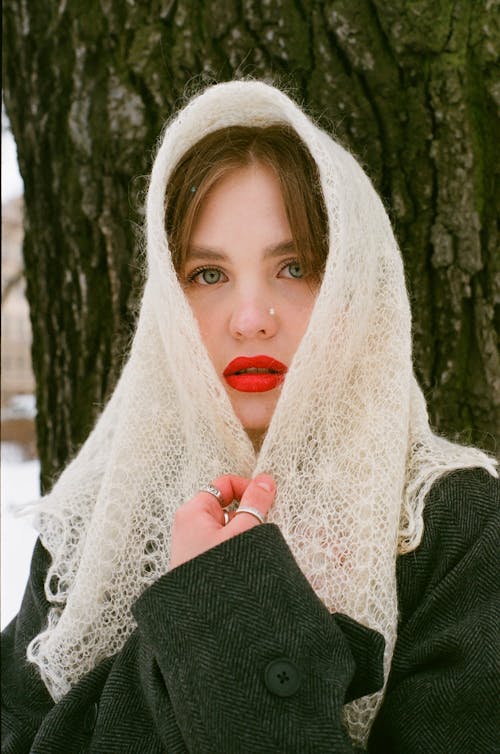 Free A Woman in Red Lipstick while Wearing Headscarf Stock Photo