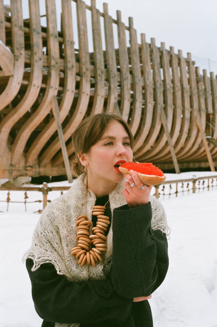 Woman Eating A Bread With Red Caviar 