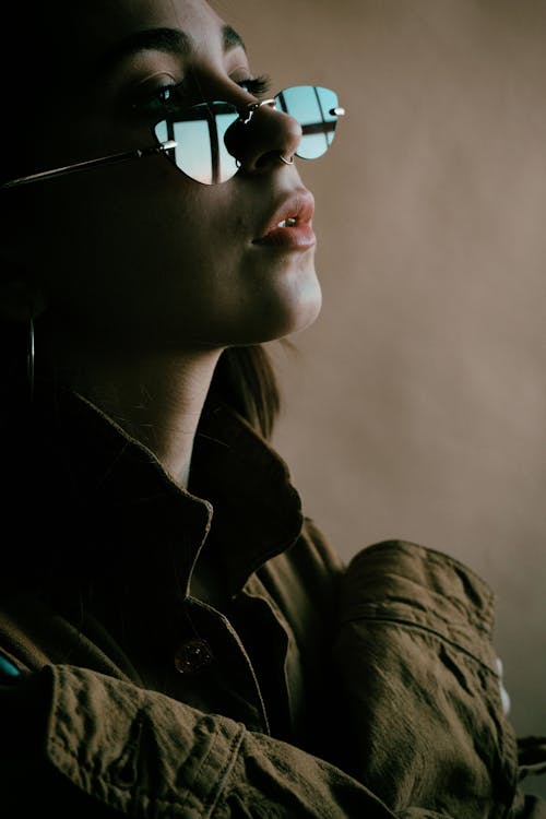 Close Up Photo of a Woman Wearing Sunglasses
