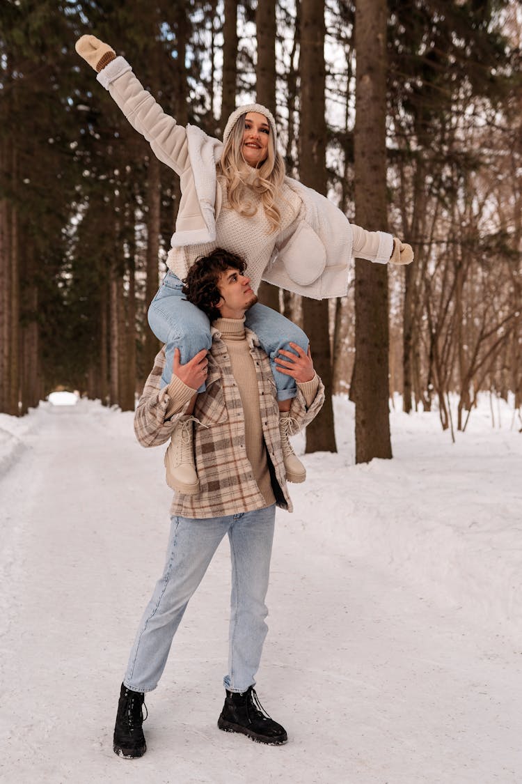 Man Carrying The Woman On His Shoulders 