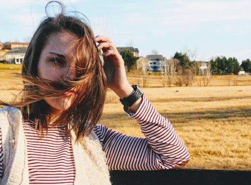 Woman About to Hold Her Hair during Daytiome