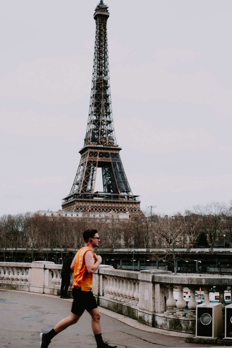 Man Jogging Near Eiffel Tower