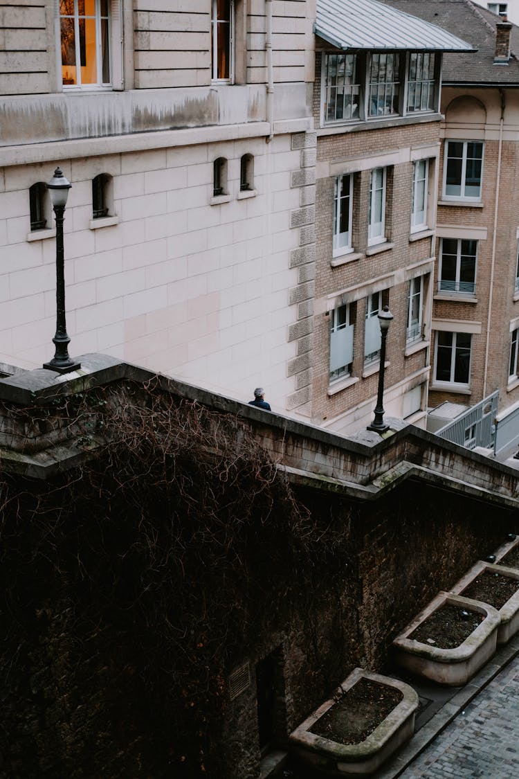 Person Walking Down On Outdoor Concrete Staircase  