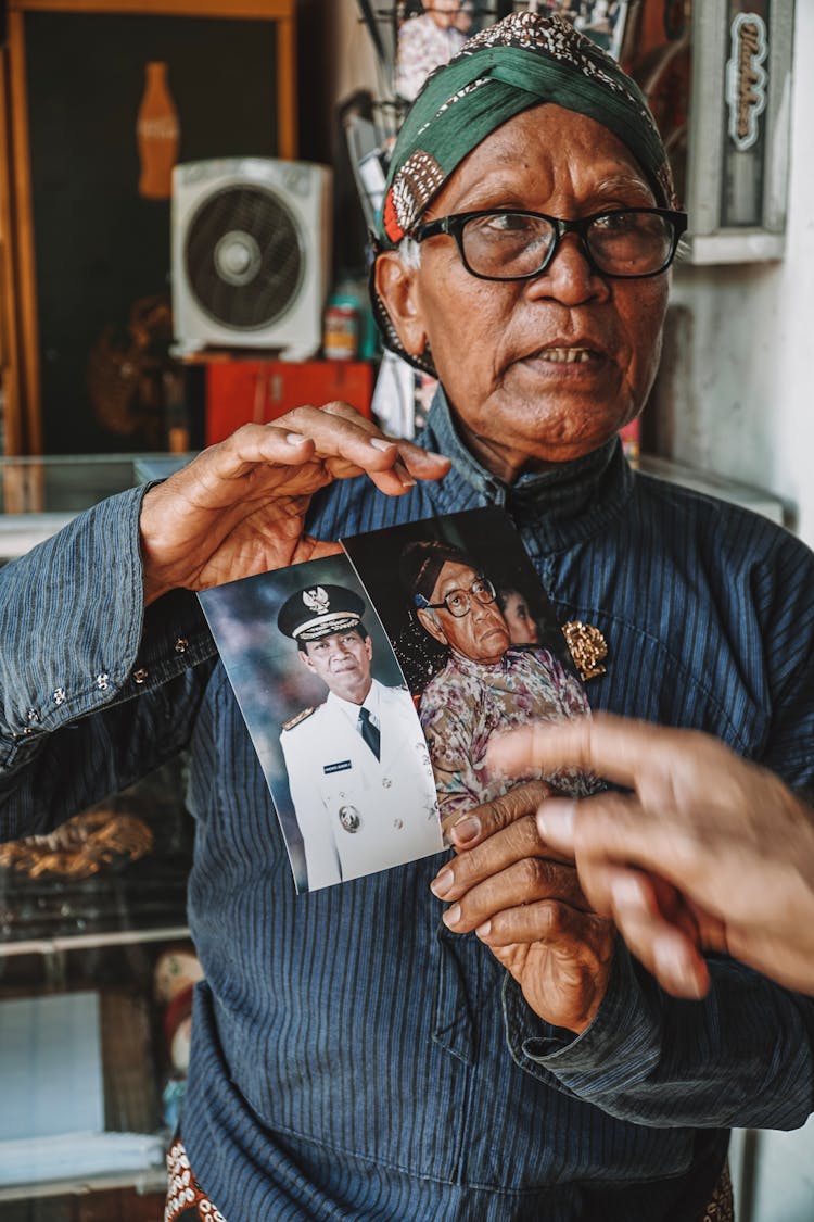 Senior Retired Military Man Showing His Photograph Pictures