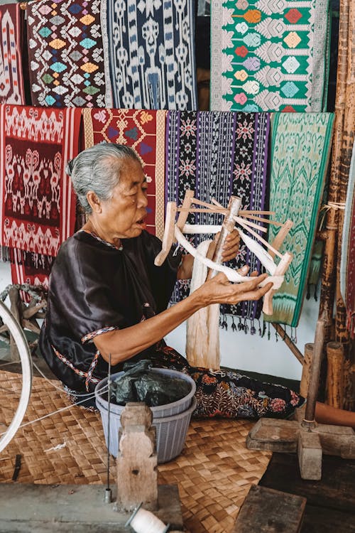 An Elderly Woman making Hadricrafts