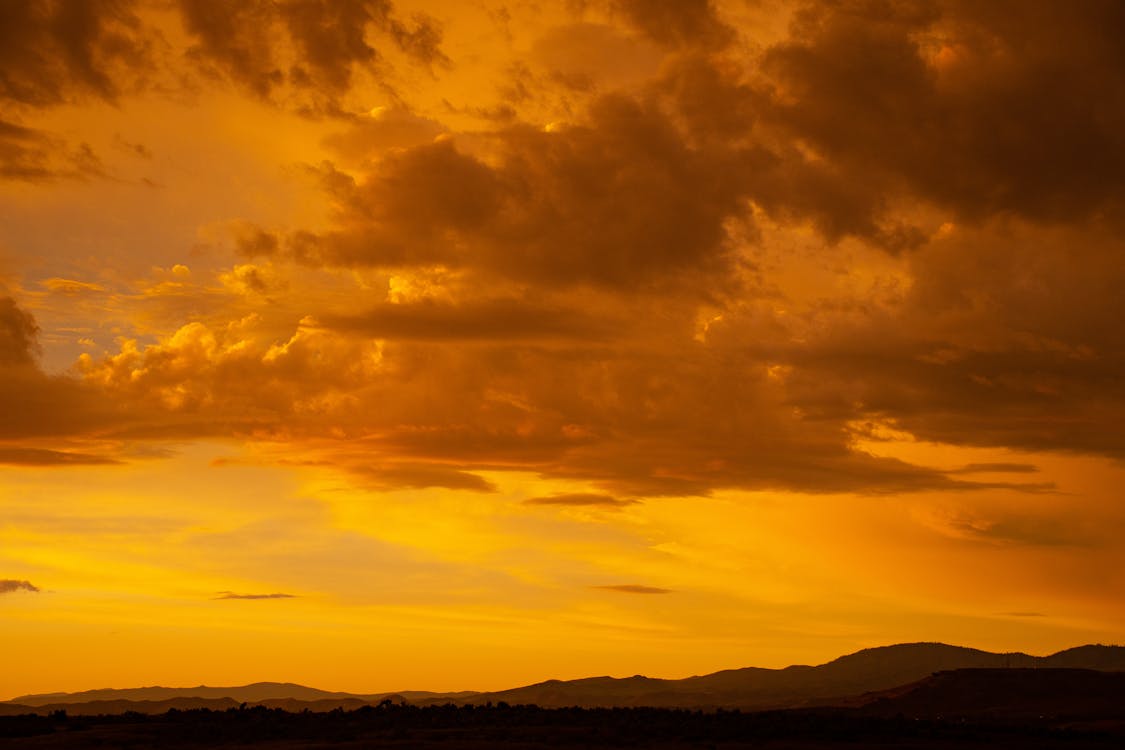 Free Sunset Under Cloudy Sky Stock Photo