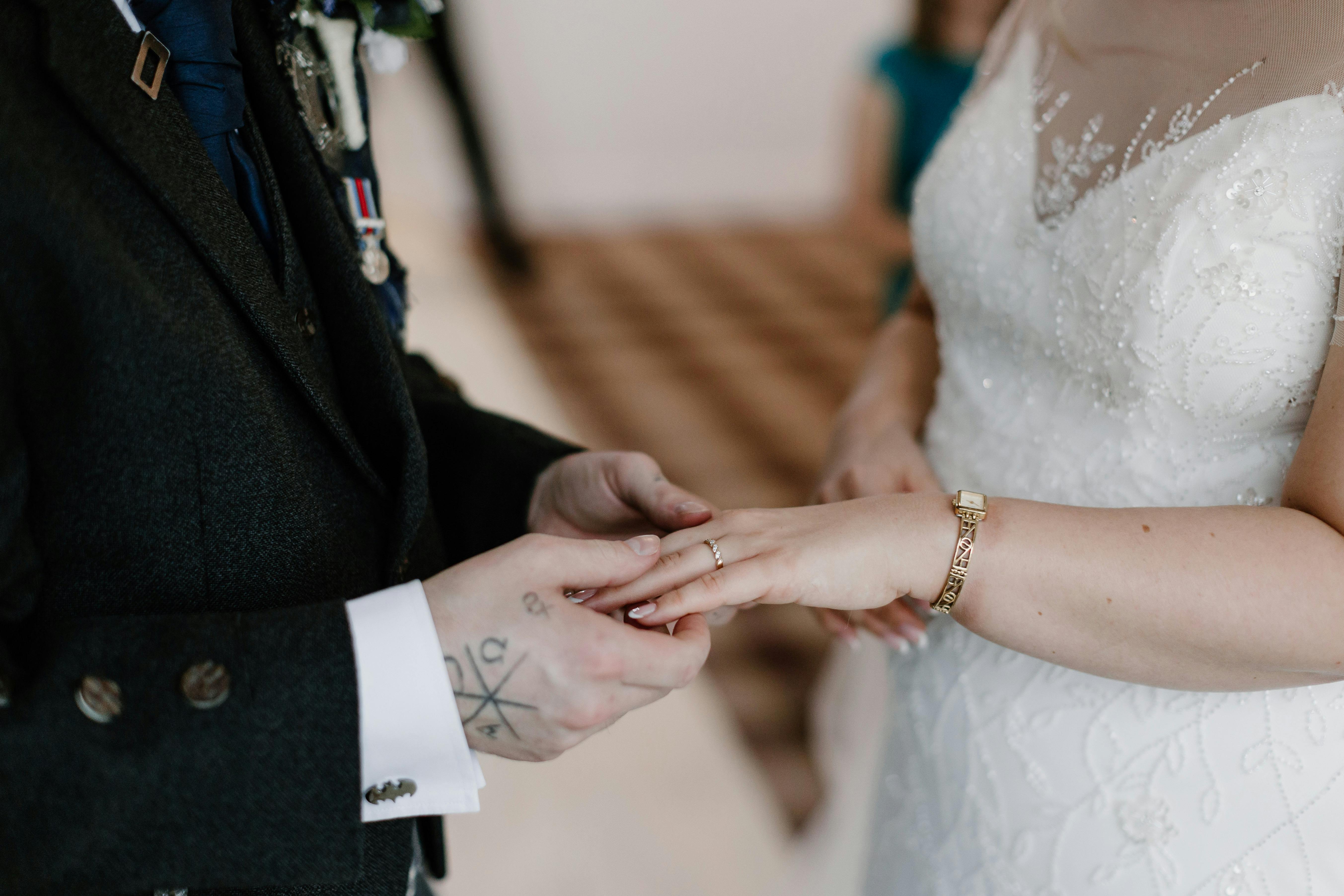 real bride and groom holding hands