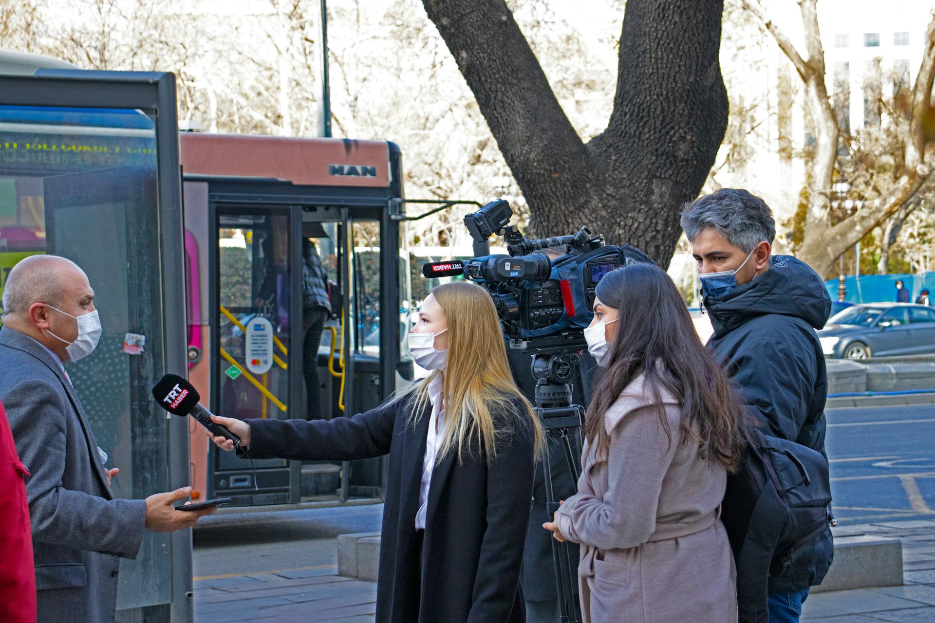 A Reporter Interviewing a Man