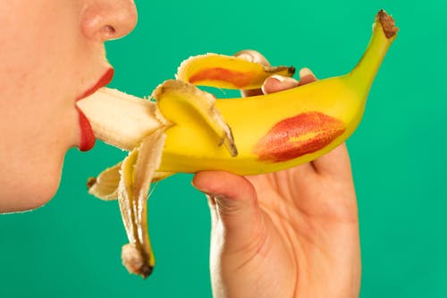 Lipstick on banana sucking penis giving blowjob