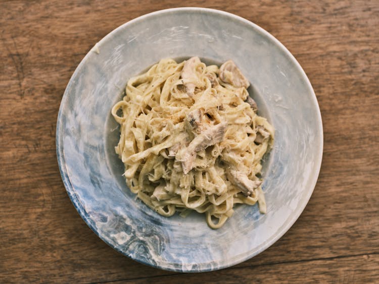 Traditional Italian Fettuccine Alfredo Pasta On Ceramic Plate