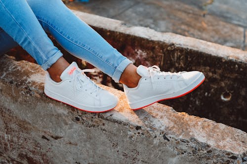Free Person in Blue Denim Jeans and White Sneakers Stock Photo