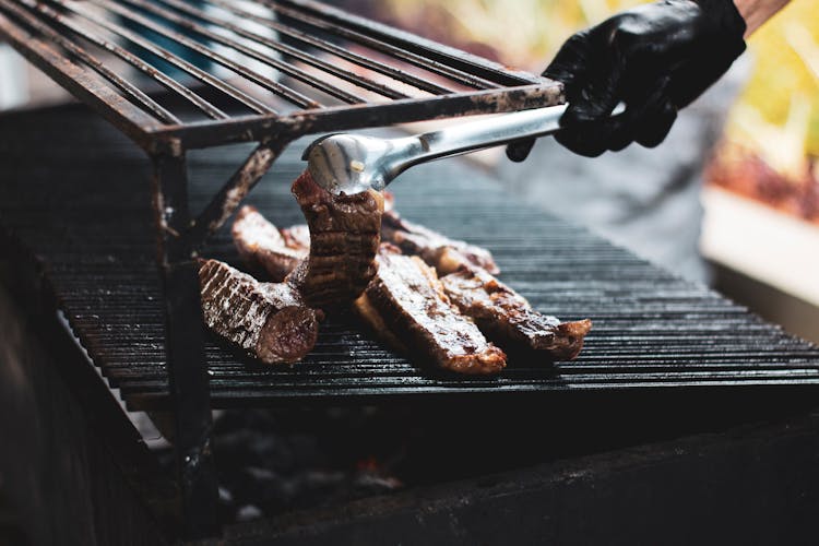 Person Grilling Beef 