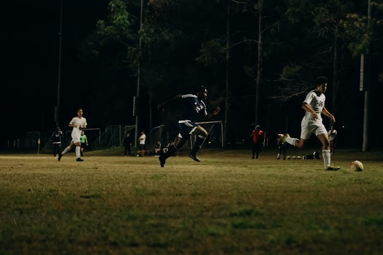 Soccer Players During A Football Match