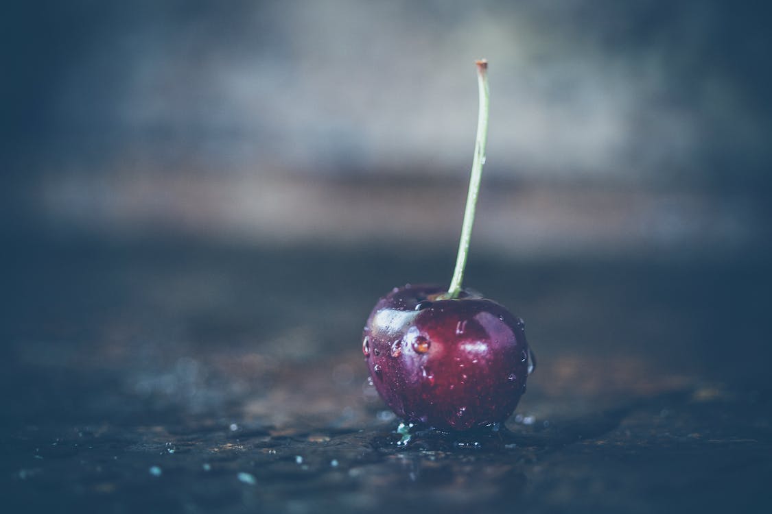 Shallow Focus Photography of Red Cherry