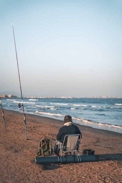 Man Fishing on Beach
