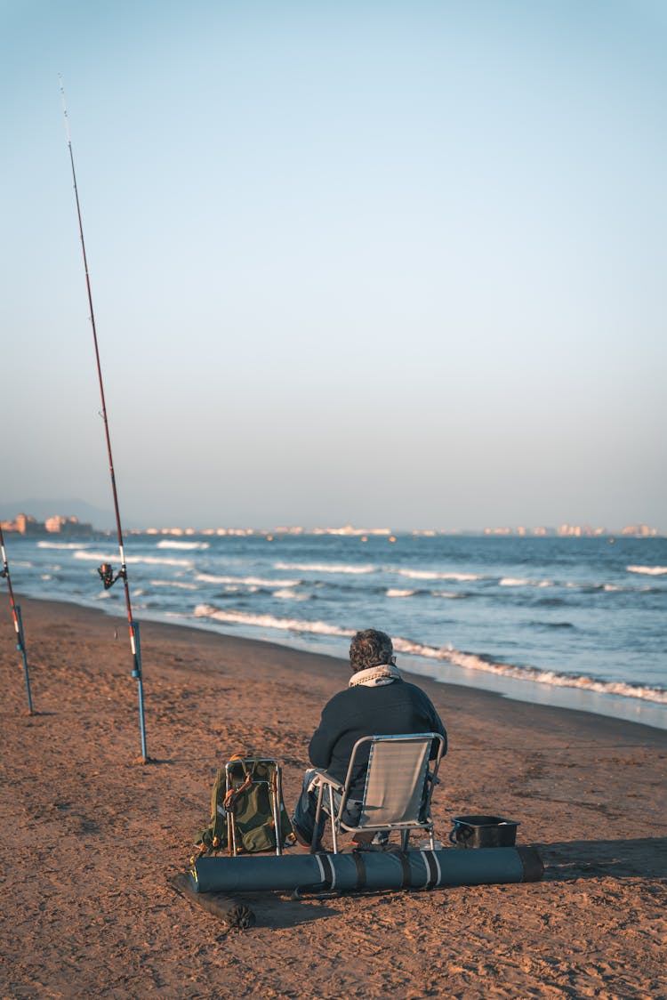 Man Fishing On Beach