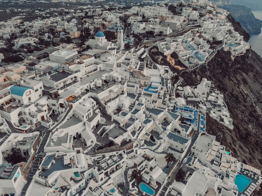 Ultimate Mykonos Helicopter Tour: 30-Minute Sightseeing Flight Review 2026 - Stunning aerial shot of Santorini capturing its iconic white architecture and blue domes.