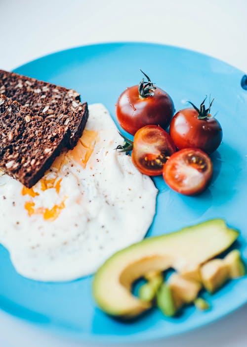 Free Sunny Side Up Egg on a Blue Plate Stock Photo