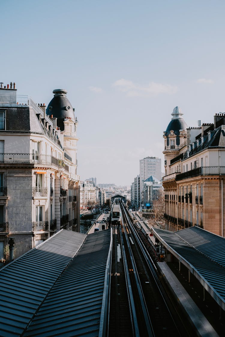 Train On Tracks On City Railway Station