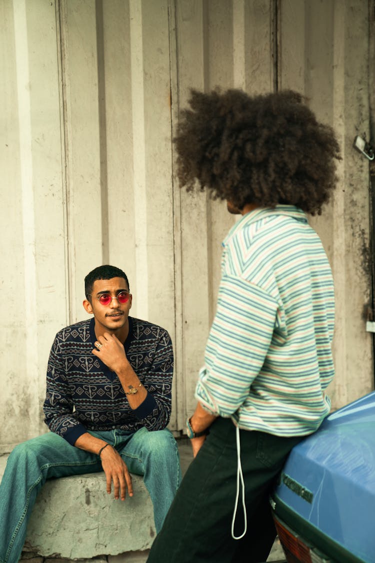 Two Men In Vintage Clothes Talking 