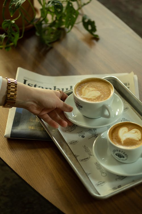 Free Two Cups of Coffee on the Tray and a Newspaper  Stock Photo