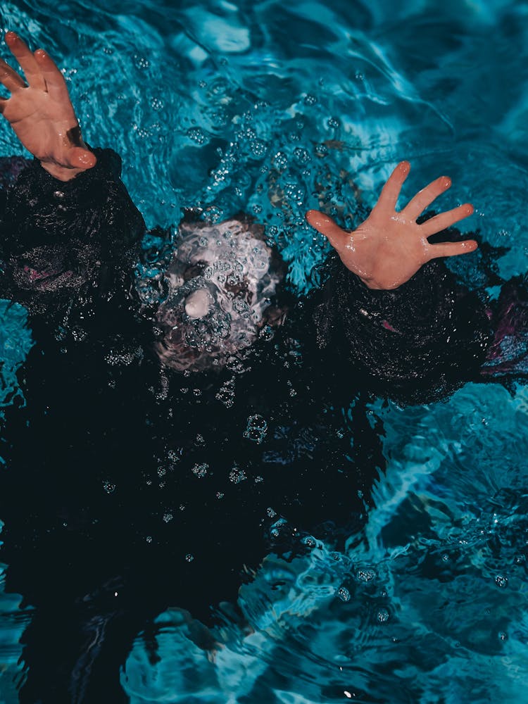 Photograph Of A Person Drowning